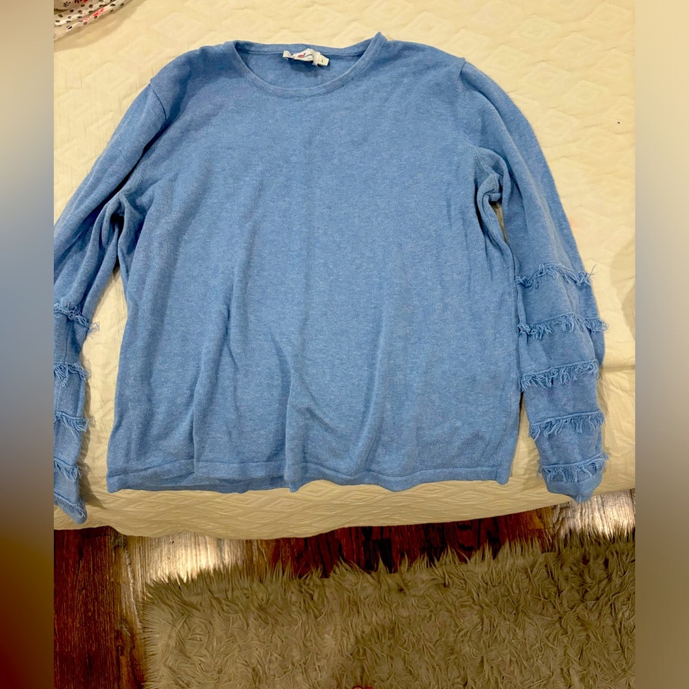 Blue ruffle sweater. Size L, perfect for a cold night.